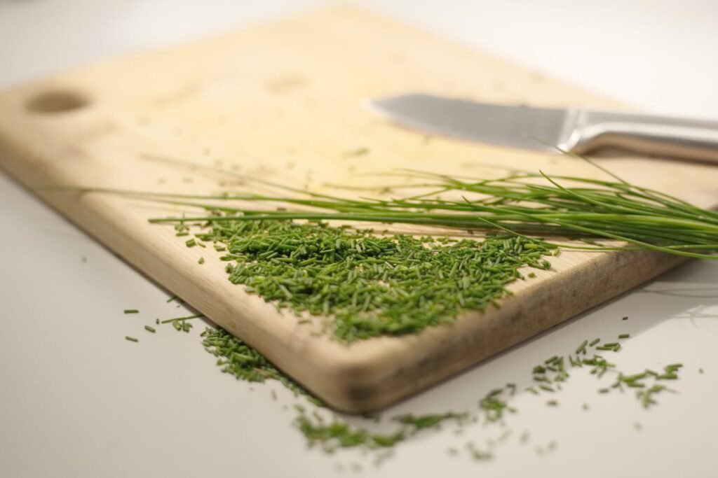 Chopped Chives on a Wooden Board